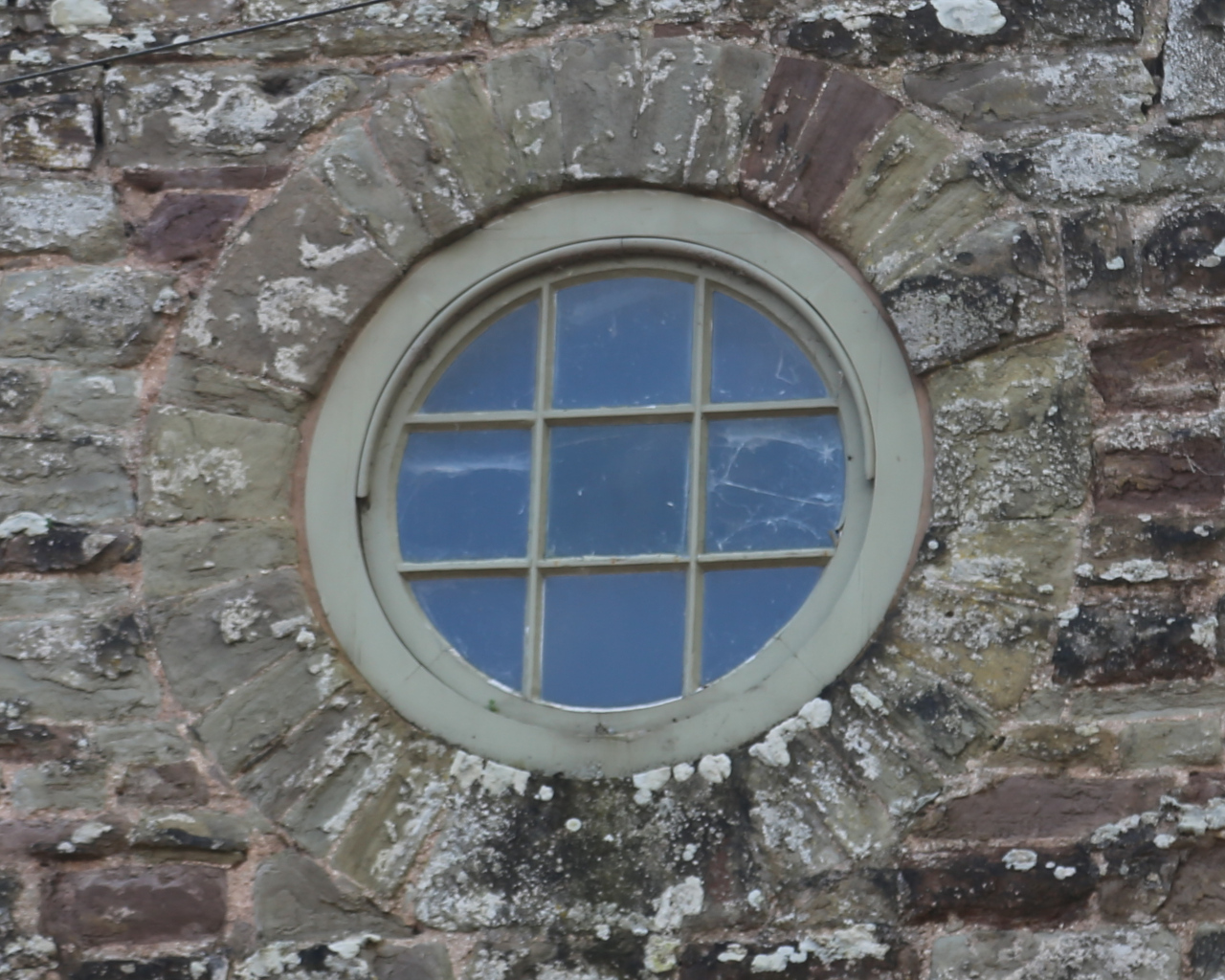 circles, squares and quarter circles on a window
