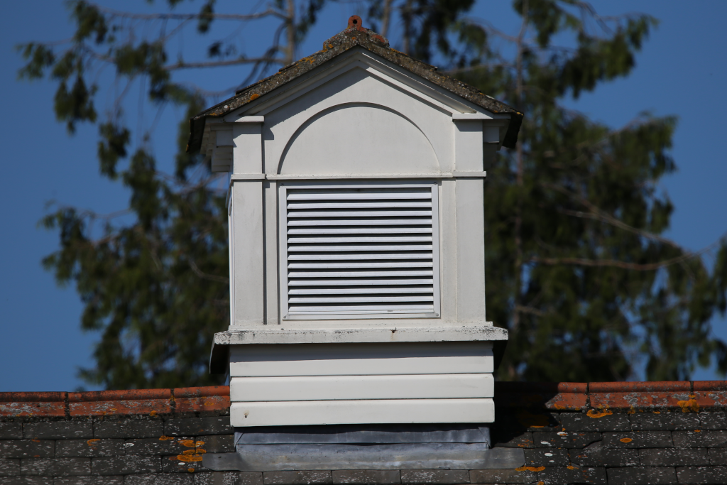 parallel, horizontal lines and a semi circle on a bell tower