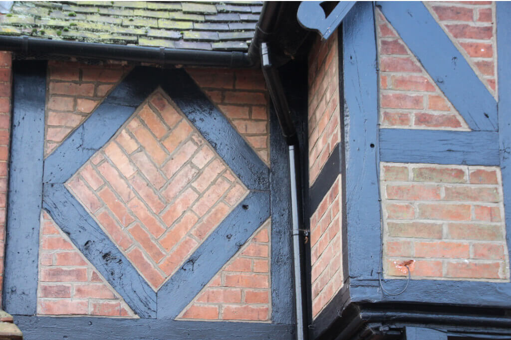 squares, diamond,triangles, brick,wood on a house